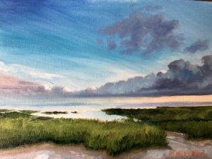 A serene landscape painting features a grassy coastal marshland under a vast sky. The sky transitions from light blue to dark gray clouds, suggesting an impending storm. The horizon divides the lush green foreground from the expansive, reflective water body.