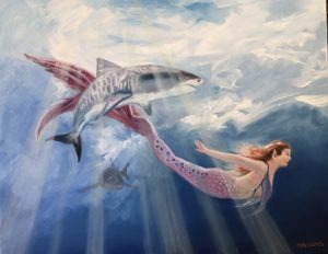 A mermaid with flowing red hair swims underwater alongside a sleek shark, surrounded by soothing shades of blue. Sunlight filters through the water, casting beams around them. A turtle glides gracefully in the background, completing this enchanting aquatic scene.