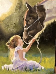 In the whisper of late afternoon sunlight, a young girl in a white dress sits on green grass, gently touching the face of a large horse. They are surrounded by soft greenery, creating a serene and tender moment between the child and the animal.
