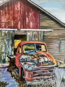 A weathered red vintage truck, marked No. 12, is parked in front of an old rustic barn with peeling red paint and wooden planks. The frosty ground and chilling air evoke the stillness of an abandoned rural setting reminiscent of Augustas bygone days.