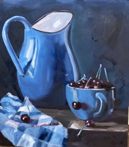 A still life painting showcases a blue pitcher, a blue cup filled with cherries, and a blue and white checkered cloth. Set against a dark background reminiscent of Dorn Mills rustic charm, the scene highlights the vibrant colors of the objects.