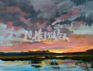 The Sunset Marsh painting captures a vibrant landscape featuring a dramatic sunset sky with dark clouds contrasting against pink and orange tones. The serene marsh below mirrors this colorful display, surrounded by lush green and earthy brown terrain.