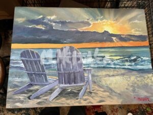 Product Beach Chairs portrays two beach chairs on a sandy shore, facing the ocean. The sun shines brilliantly, either setting or rising, casting vibrant rays through scattered clouds and creating a beautiful reflection on the water.