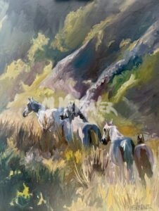 Four white horses are walking through tall grass in a sunlit, hilly landscape with soft, natural colors and dappled light. The scenery features slopes and greenery, creating a peaceful, natural setting.