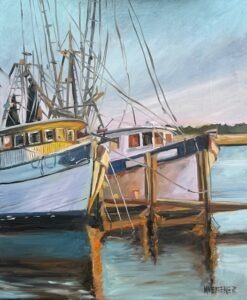 Two docked fishing boats with tall masts and rigging, reflecting in calm water. The scene is painted with warm sunlight and a soft sky, giving a peaceful, coastal atmosphere.